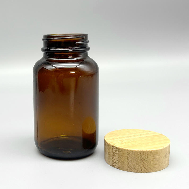 Hot Sale Amber Glass Jar Bamboo Lid 60-200ml Cosmetic Packaging Bottle Hot Sale Amber Glass Jar Bamboo Lid 60-200ml Cosmetic Packaging Bottle