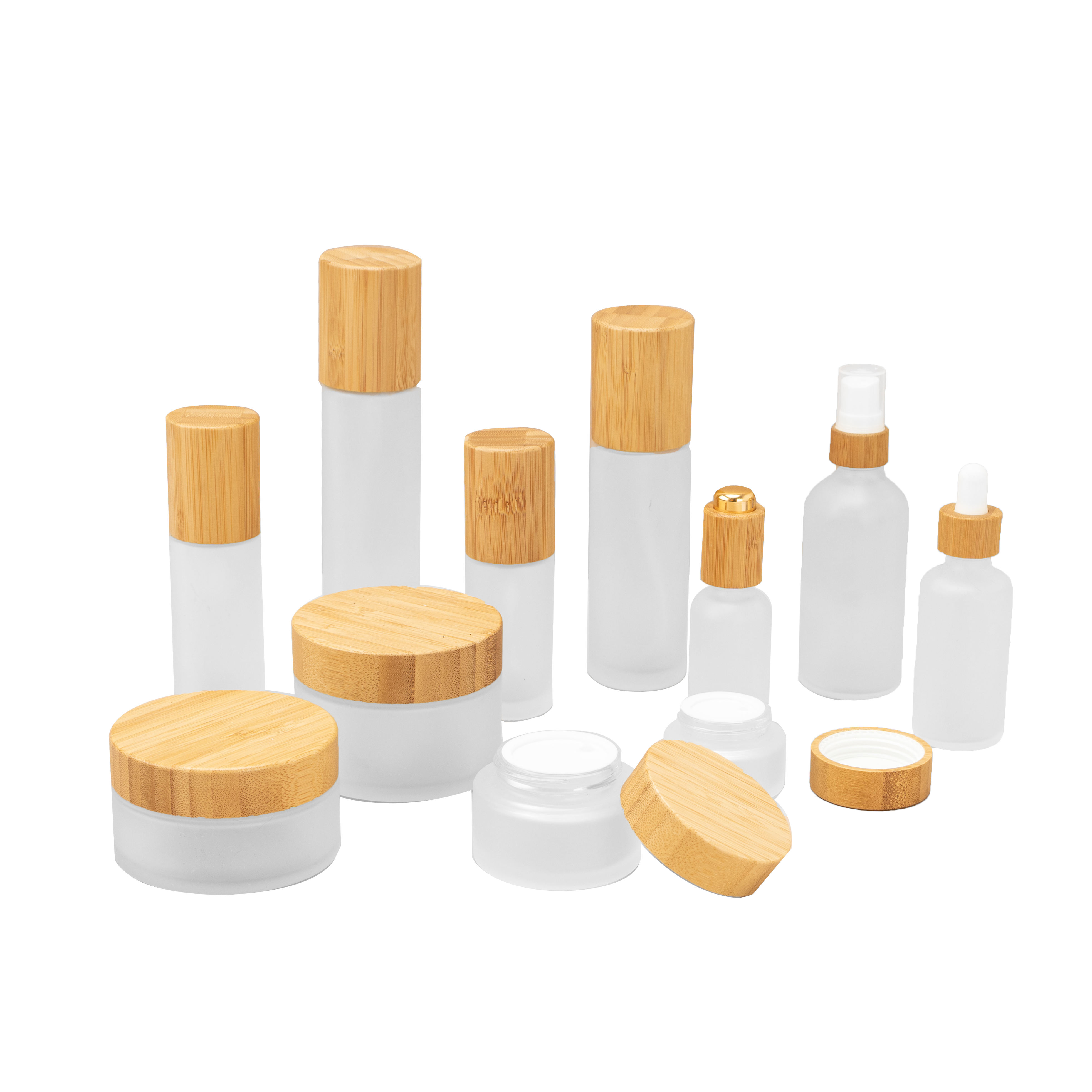 High Quality 100ml Oval Cosmetic Packaging Set Empty Set Clear Frosted Glass Cream Jar with Bamboo Lid Screw Cap Glass Bottle