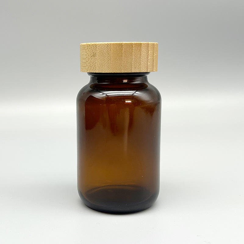 Wholesale Amber Glass Medicine Bottle with Bamboo Lid 60ml 75ml 100ml 200ml Supplement Jar Custom Labels Logos Cosmetic jar Wholesale Amber Glass Medicine Bottle with Bamboo Lid 60ml 75ml 100ml 200ml Supplement Jar Custom Labels Logos Cosmetic jar