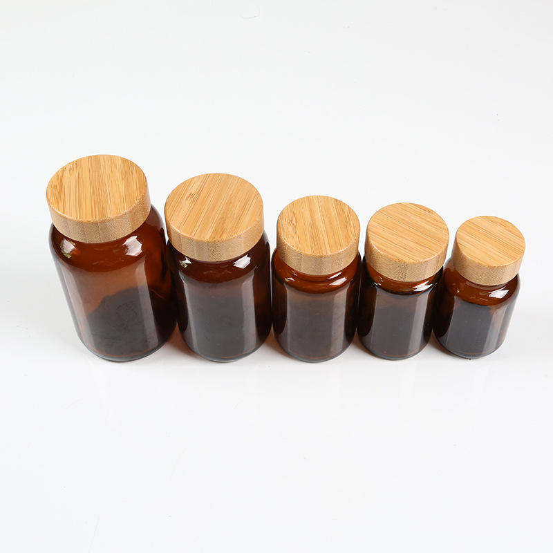 Wholesale Amber Glass Medicine Bottle with Bamboo Lid 60ml 75ml 100ml 200ml Supplement Jar Custom Labels Logos Cosmetic jar Wholesale Amber Glass Medicine Bottle with Bamboo Lid 60ml 75ml 100ml 200ml Supplement Jar Custom Labels Logos Cosmetic jar