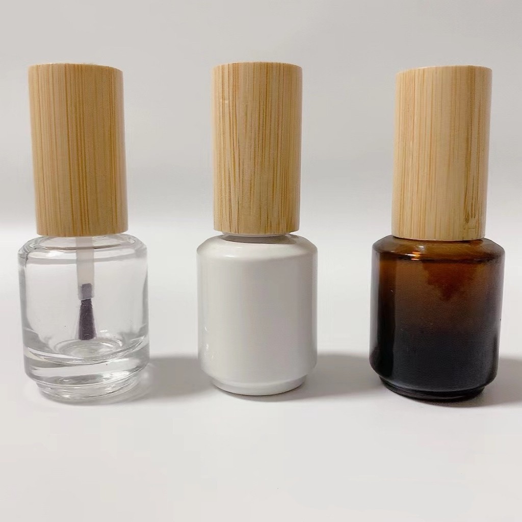 Custom High Quality Empty Reusable 10ml Cylinder Glass Gel Nail Polish Bottles with Bamboo Cap Custom High Quality Empty Reusable 10ml Cylinder Glass Gel Nail Polish Bottles with Bamboo Cap