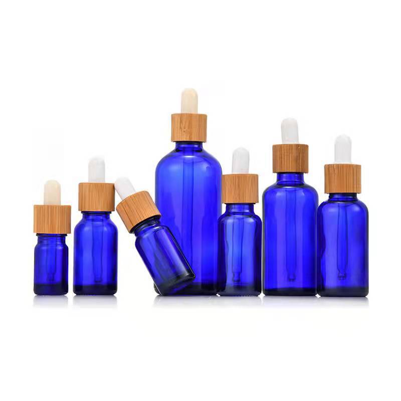 High Quality 30ml Frosted Glass Dropper Bottles with Natural Beech Wood Bamboo Lid for Essential Oil Serum Cosmetic Packaging High Quality 30ml Frosted Glass Dropper Bottles with Natural Beech Wood Bamboo Lid for Essential Oil Serum Cosmetic Packaging