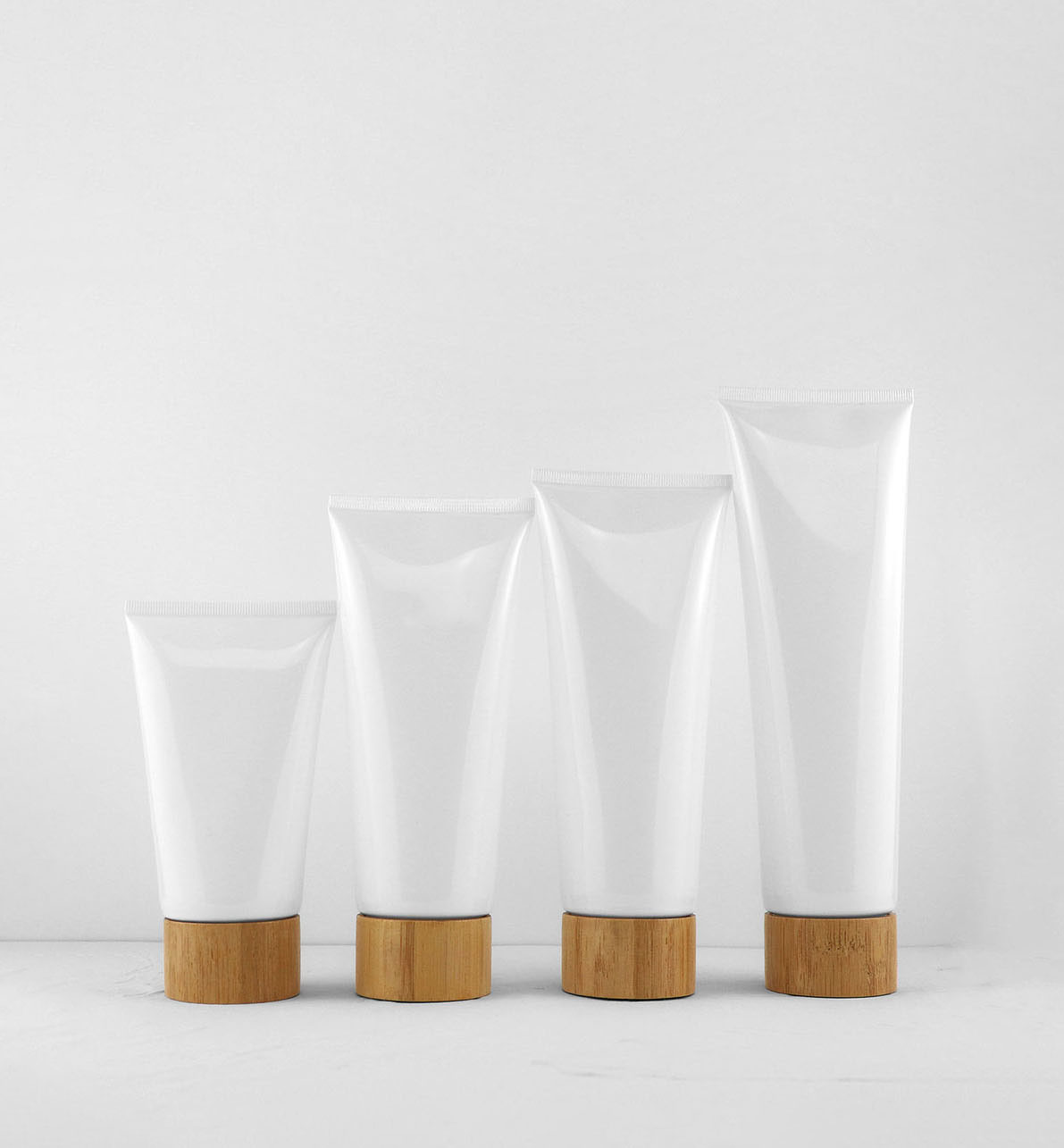 Custom Empty Matte White Cosmetic Squeeze Tube with Natural Bamboo Screw Cap for Face Wash Hand Cream Sunscreen Container Custom Empty Matte White Cosmetic Squeeze Tube with Natural Bamboo Screw Cap for Face Wash Hand Cream Sunscreen Container