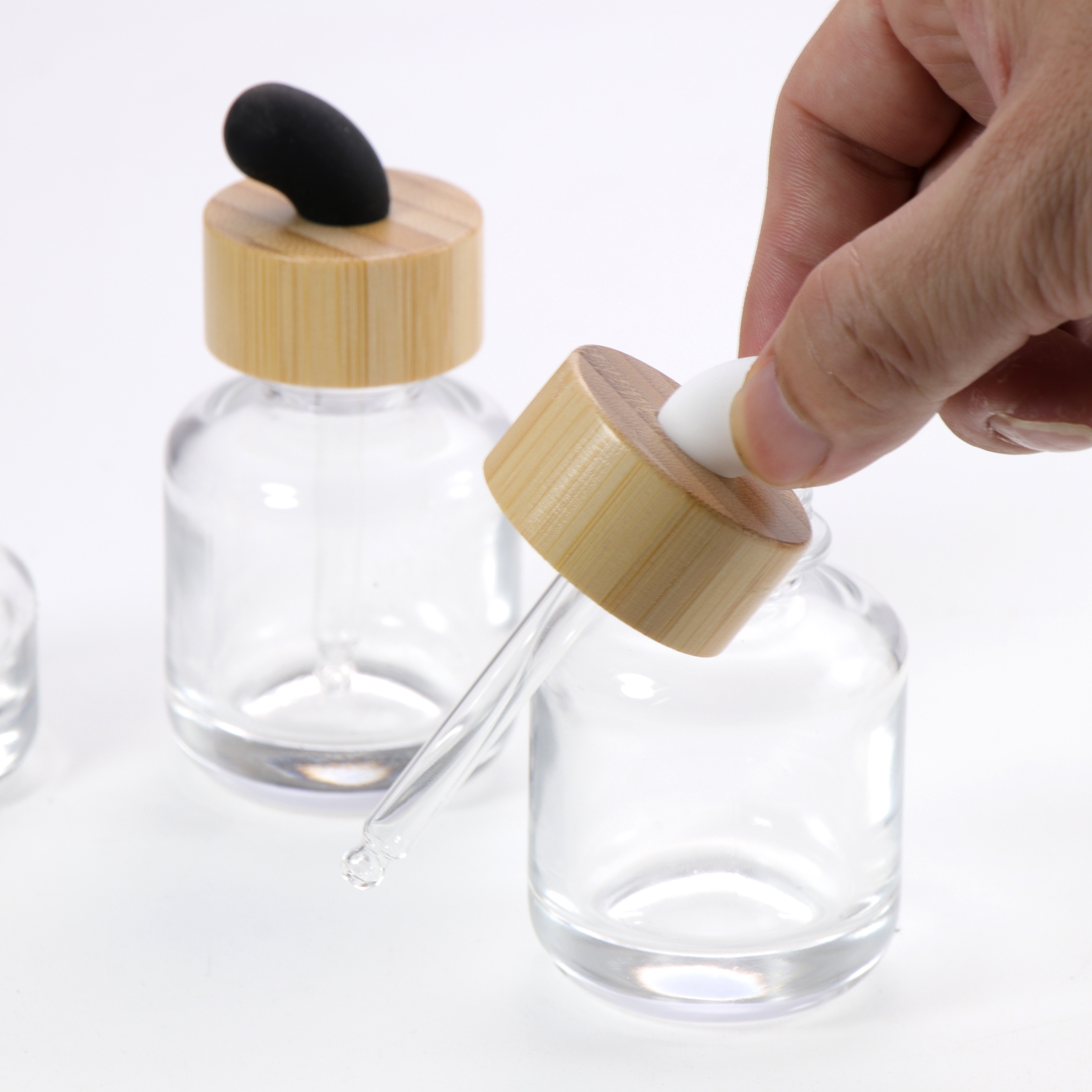 New Product Essential Oil Bottle Eco Friendly Clear Glass Dropper Packaging with Natural Bamboo Ring Cap for Face Serum Hair Oil