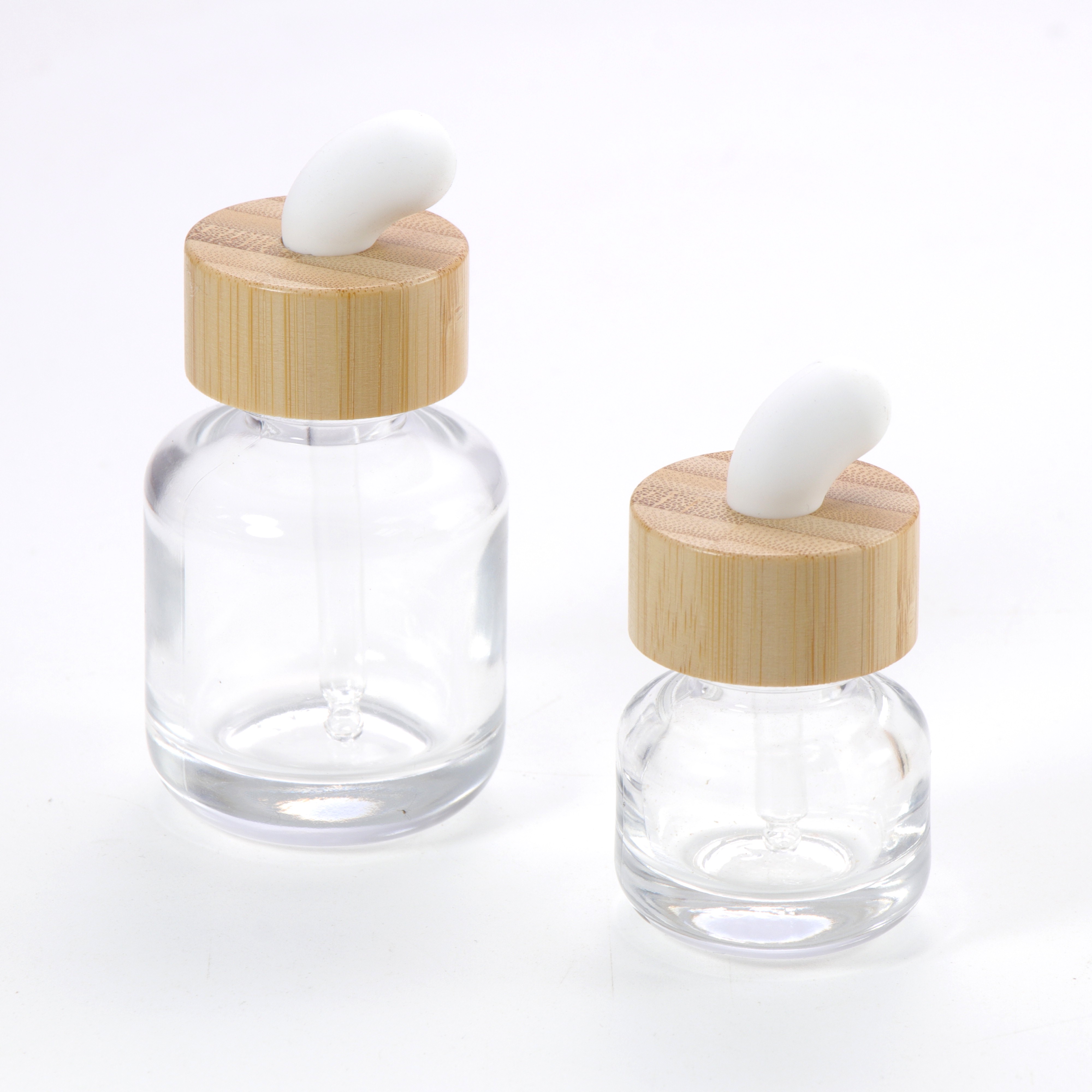 New Product Essential Oil Bottle Eco Friendly Clear Glass Dropper Packaging with Natural Bamboo Ring Cap for Face Serum Hair Oil