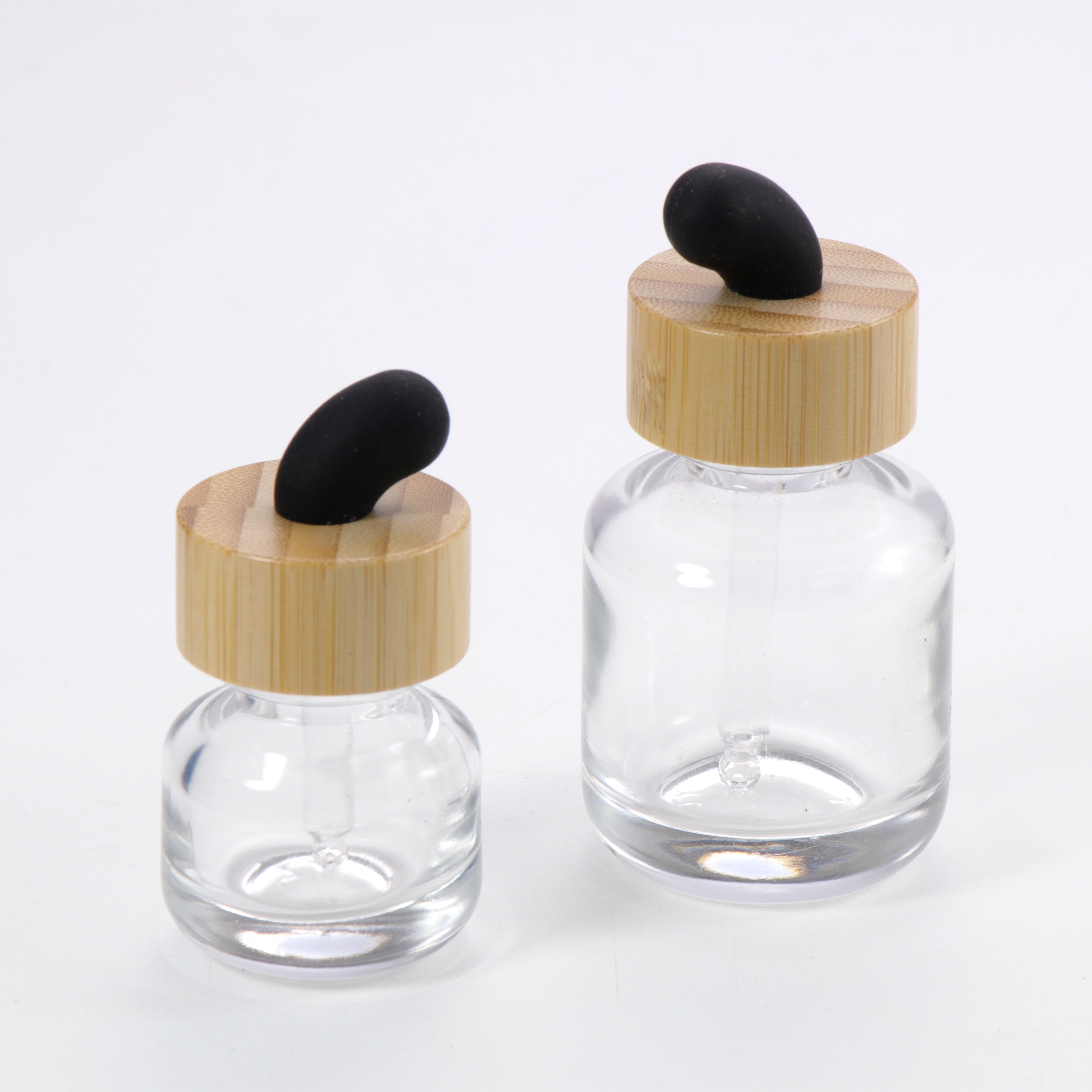 New Product Essential Oil Bottle Eco Friendly Clear Glass Dropper Packaging with Natural Bamboo Ring Cap for Face Serum Hair Oil