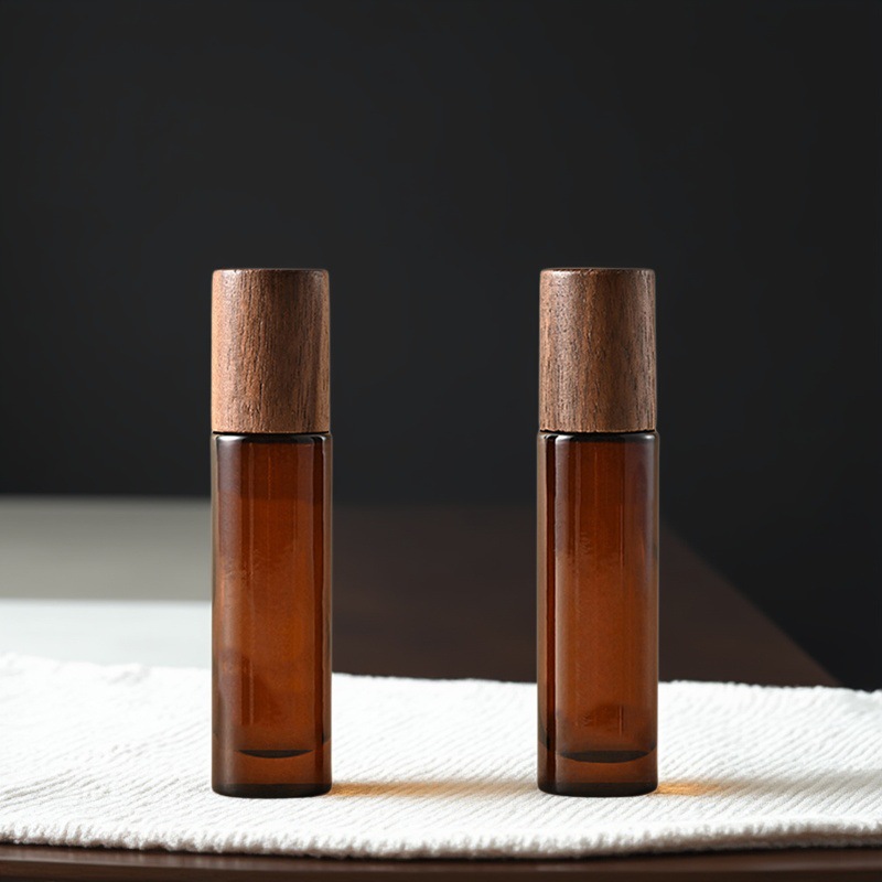 Amber Glass Roller Bottle 5ml 10ml with Magnetic Black Walnut Wooden Cap Custom Logo Essential Oil Skincare Packaging Container Amber Glass Roller Bottle 5ml 10ml with Magnetic Black Walnut Wooden Cap Custom Logo Essential Oil Skincare Packaging Container