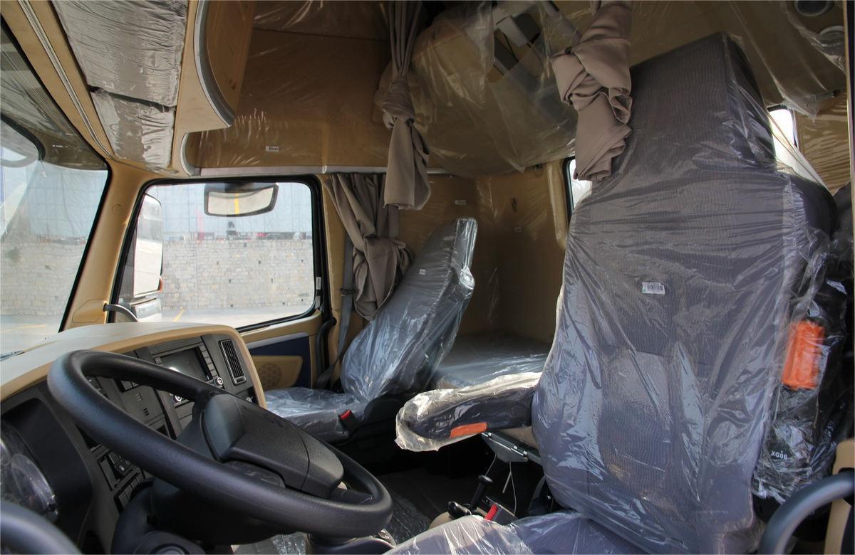 HOWO A7 420HP 6x4 tractor truck cabin interior with ergonomic layout, air suspension seat, and sleeper berth