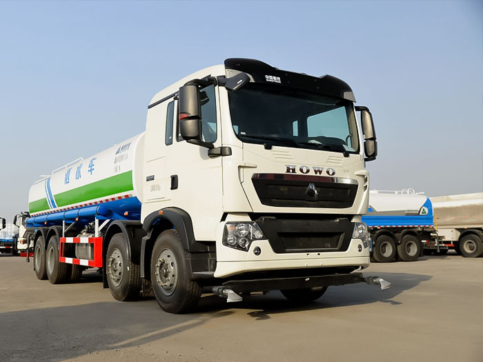HOWO 8x4 310HP water tanker truck front three quarter view highlighting large tank and 8x4 chassis
