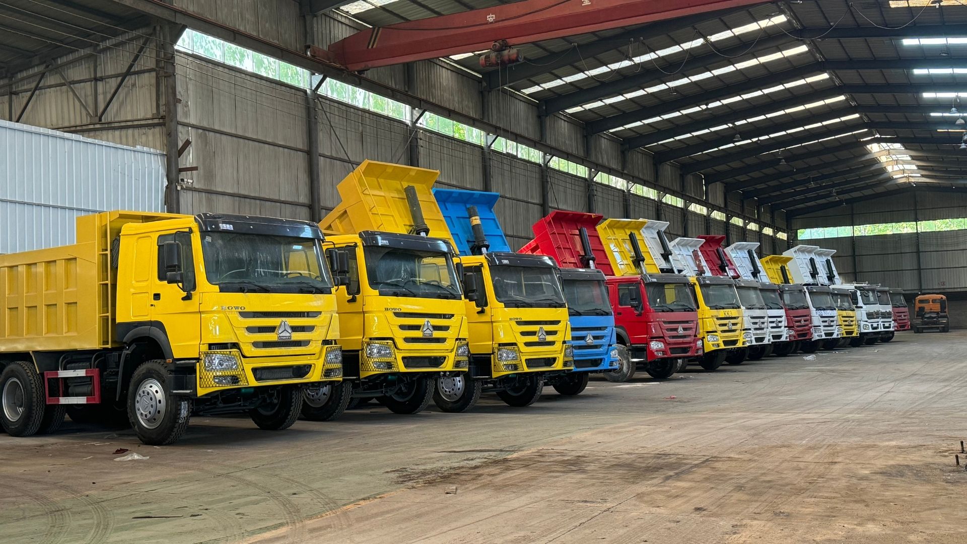 ZW Group factory inventory: massive stock of HOWO 6x4 and 8x4 dump trucks for rapid international export.