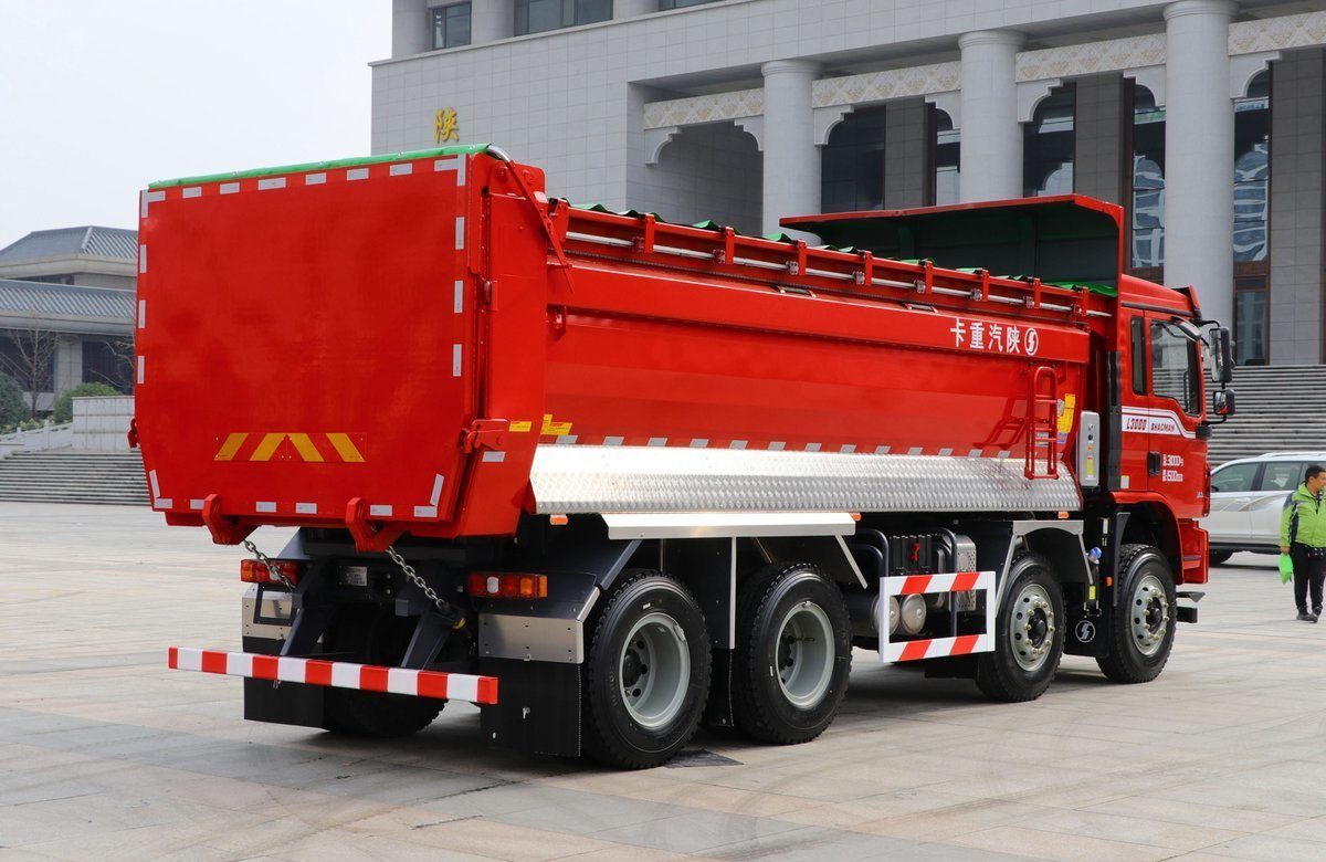 Shacman L3000 8x4 350HP dump truck rear three quarter view showing dump body tilt and rear frame