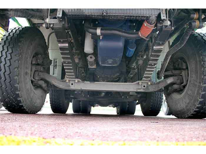Shacman M3000 8x4 heavy duty dump truck chassis showing reinforced frame and suspension