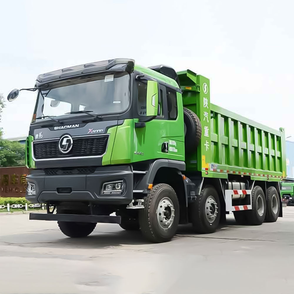 Shacman X5000 8x4 heavy duty dump truck front three quarter view highlighting dump body and premium cab design