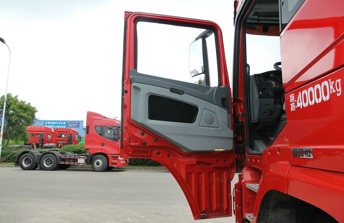 Shacman X3000 6x4 heavy duty tractor truck driver side door detail showing durable cabin structure