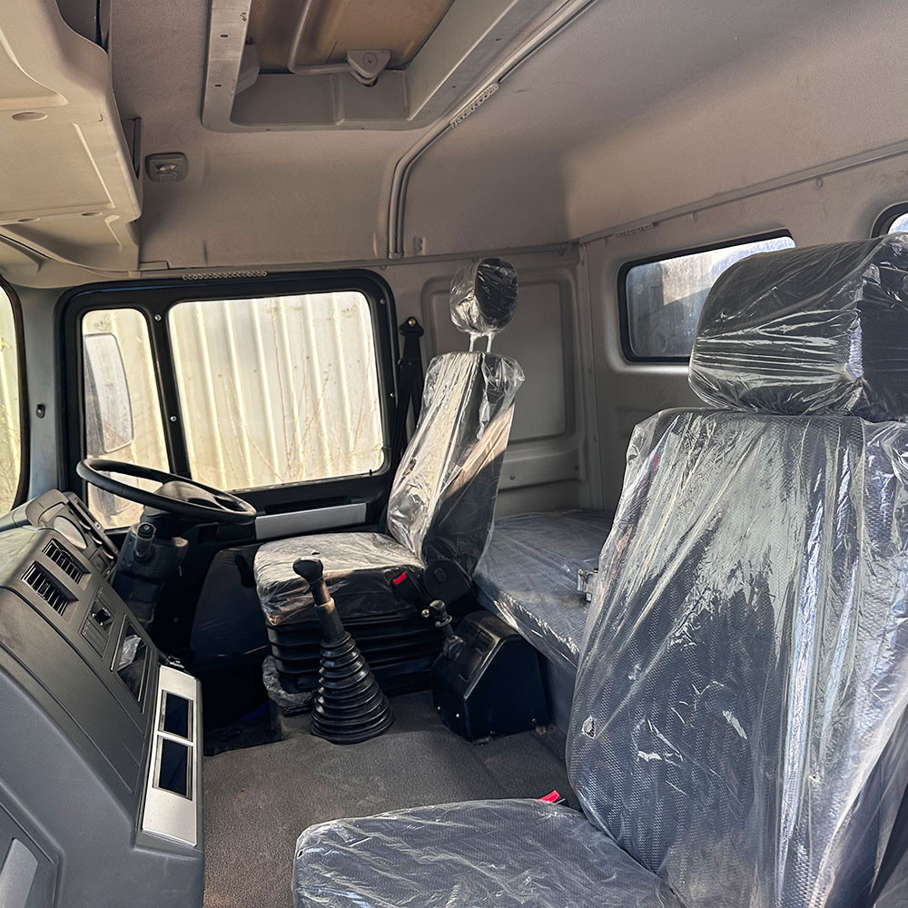 Shacman F3000 6x4 heavy duty water tanker truck cabin interior showing ergonomic layout and driver comfort