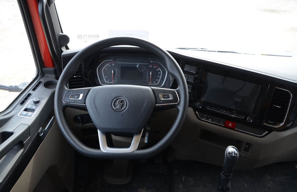 Shacman L5000 4x2 heavy duty cargo truck steering wheel detail with multifunction controls