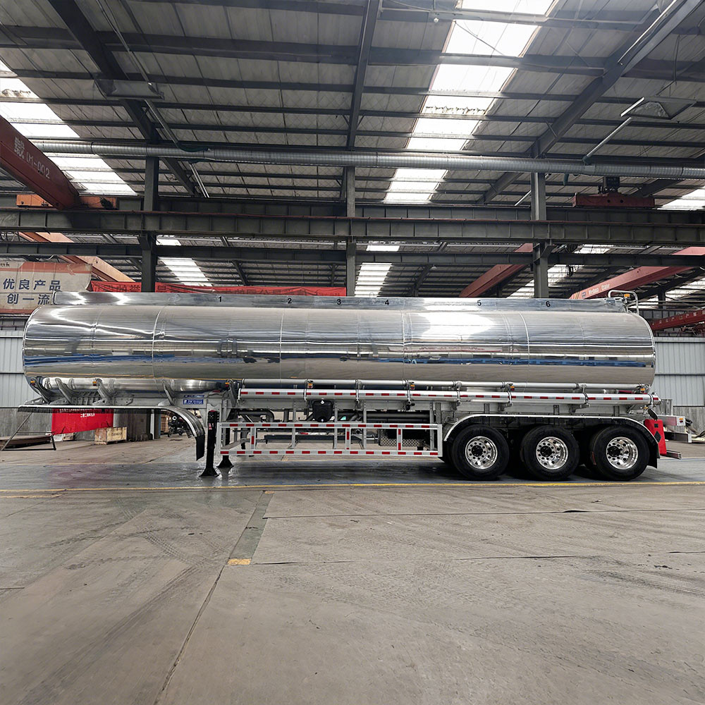 3 axle polished aluminum diesel gasoline tanker semi trailer side view showing lightweight aluminum tank and suspension system