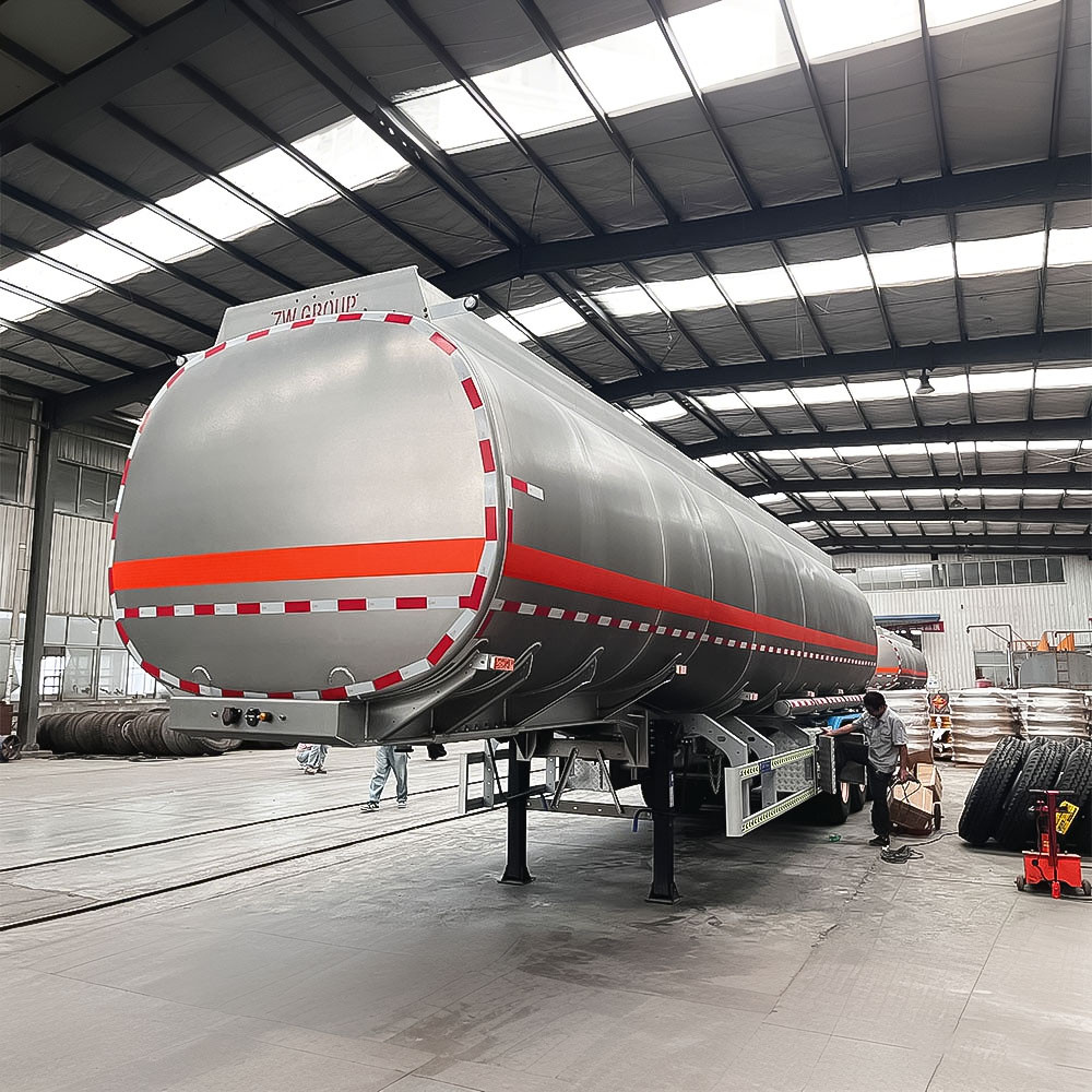 3 axle 42,000L carbon steel fuel tanker semi trailer front three quarter view highlighting tank body and axle configuration