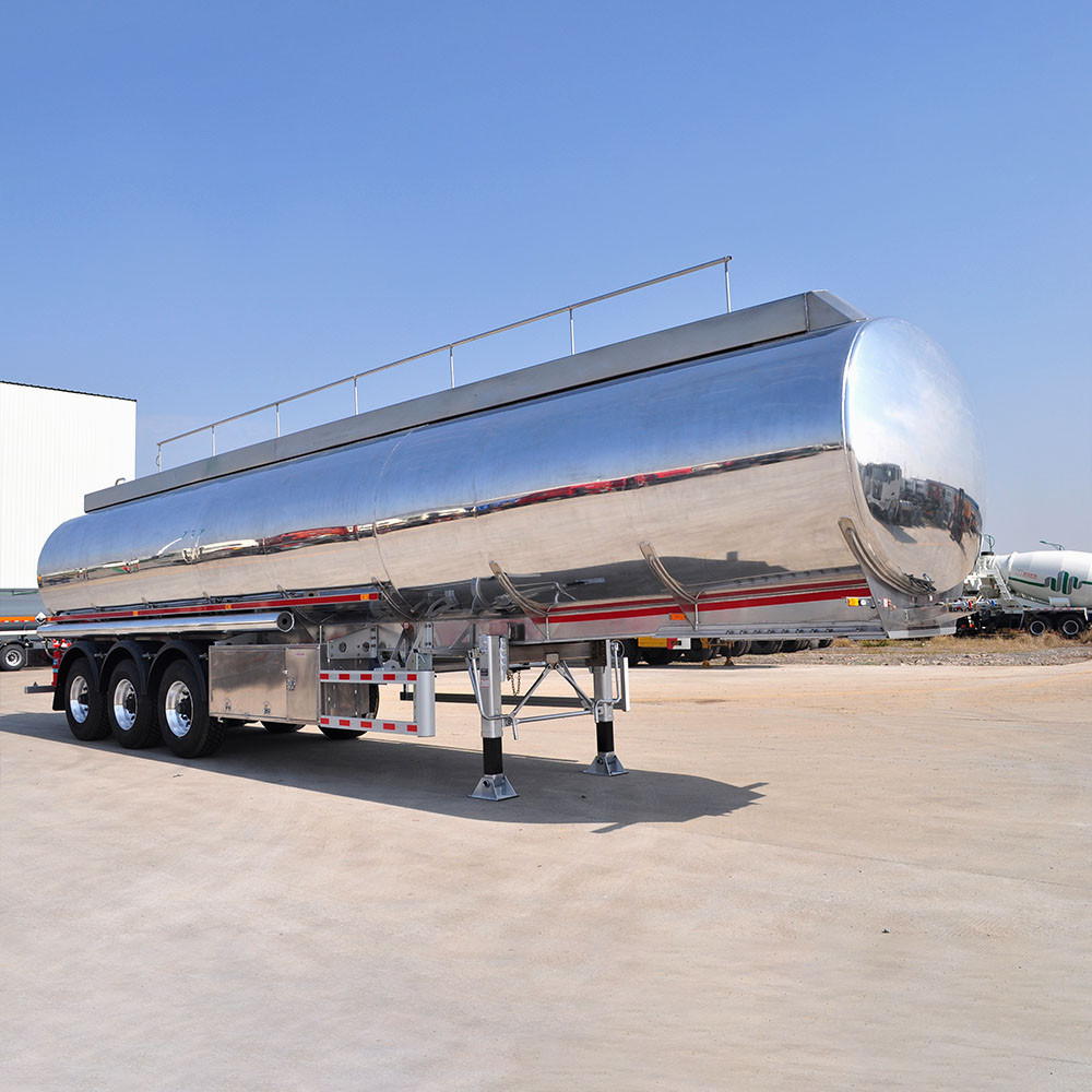 3 axle aluminum tanker trailer front three quarter view highlighting tank body and axle layout