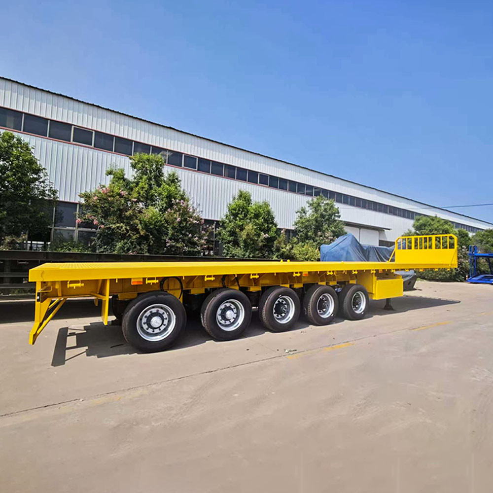 5 axle flatbed semi trailer side view showing extended flat deck for oversized cargo transport