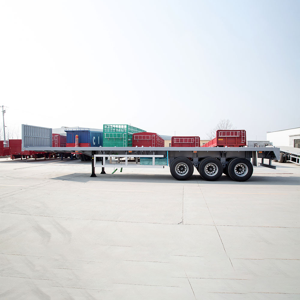 40ft flatbed semi trailer side view showing full length flat deck for container and steel transport