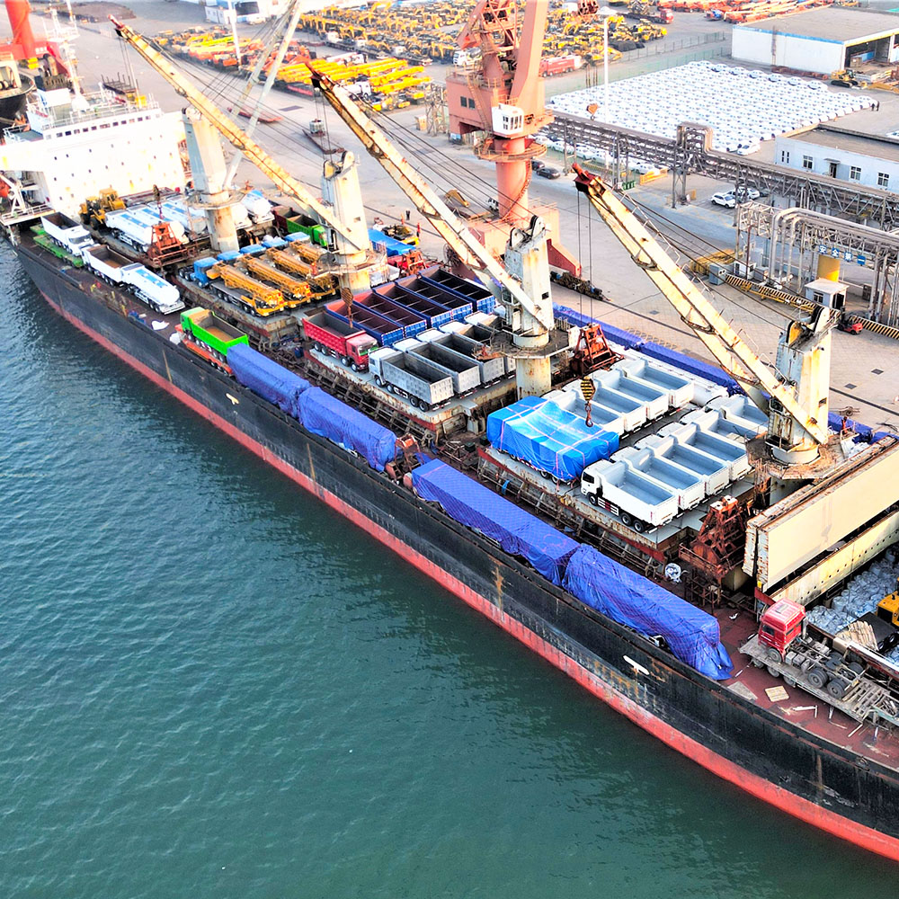 Cargo ship loaded with HOWO and Shacman tipper trucks for Africa: ZW Group's large-scale export of mining transport solutions.