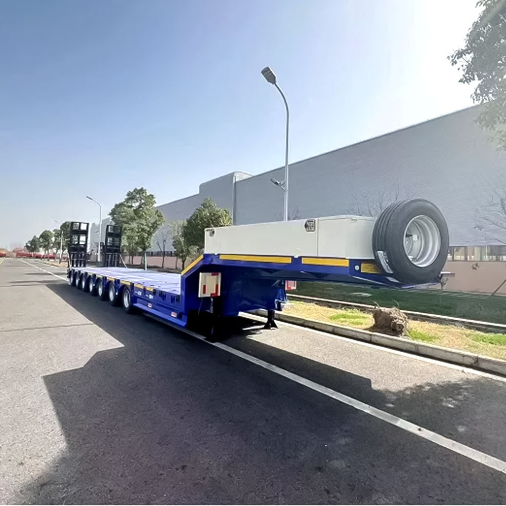 7 axle extendable low loader trailer front three quarter view highlighting the extendable deck and reinforced axle layout