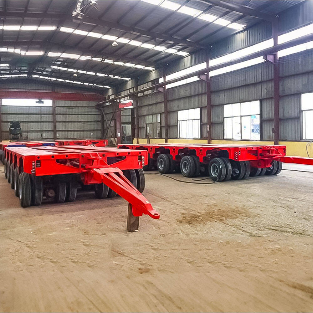 SPMT hydraulic modular trailer side view carrying heavy industrial module