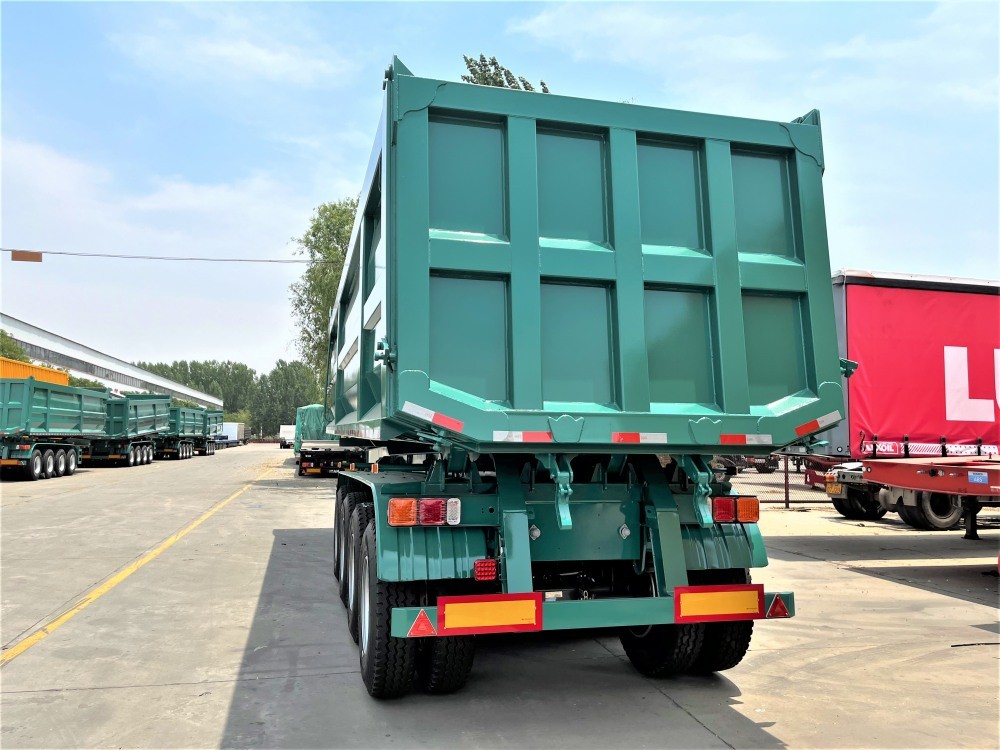 4 axle 35CBM tipper semi trailer front view showing reinforced dump body and chassis
