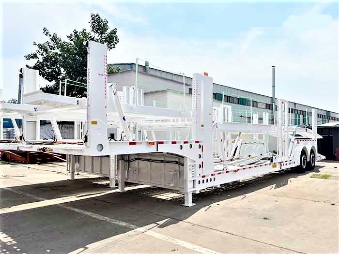 2 axle double deck car carrier trailer front three quarter view highlighting double deck structure and axle layout