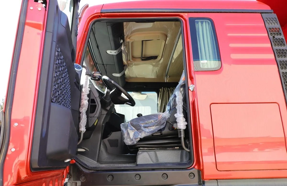 truck cabin front three quarter view highlighting ergonomic design, doors, and side mirrors