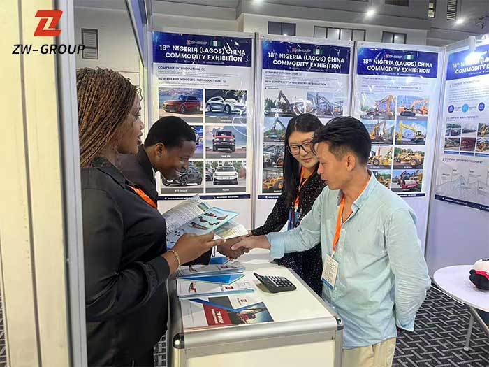 ZW Group staff presenting product catalog to clients at exhibition booth