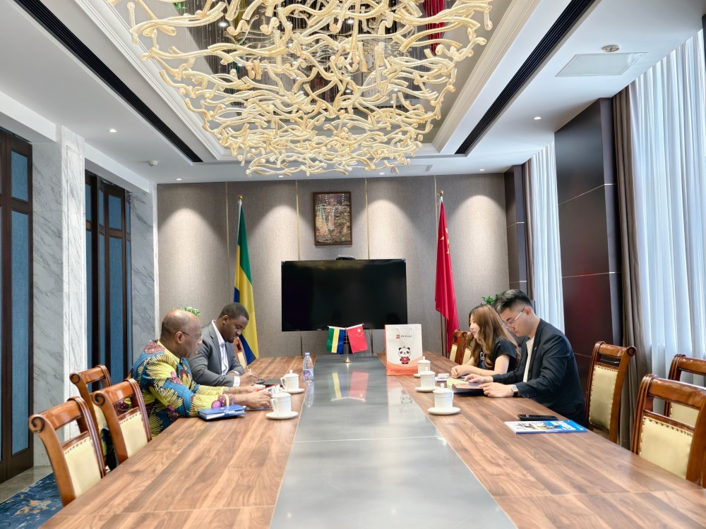 Official conference between Gabon Embassy and ZW Group, a premier Truck and Trailer Supplier China, discussing fleet logistics.