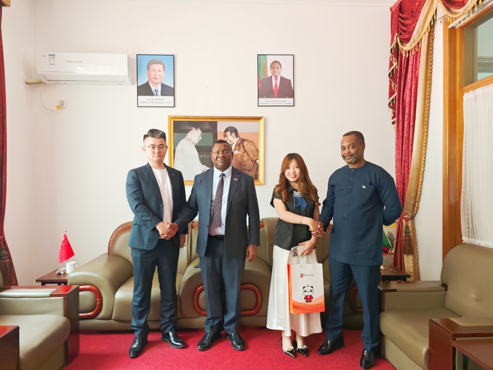 ZW Group executives shaking hands with Zambian Embassy officials, securing a reliable Truck and Trailer Supplier China channel.