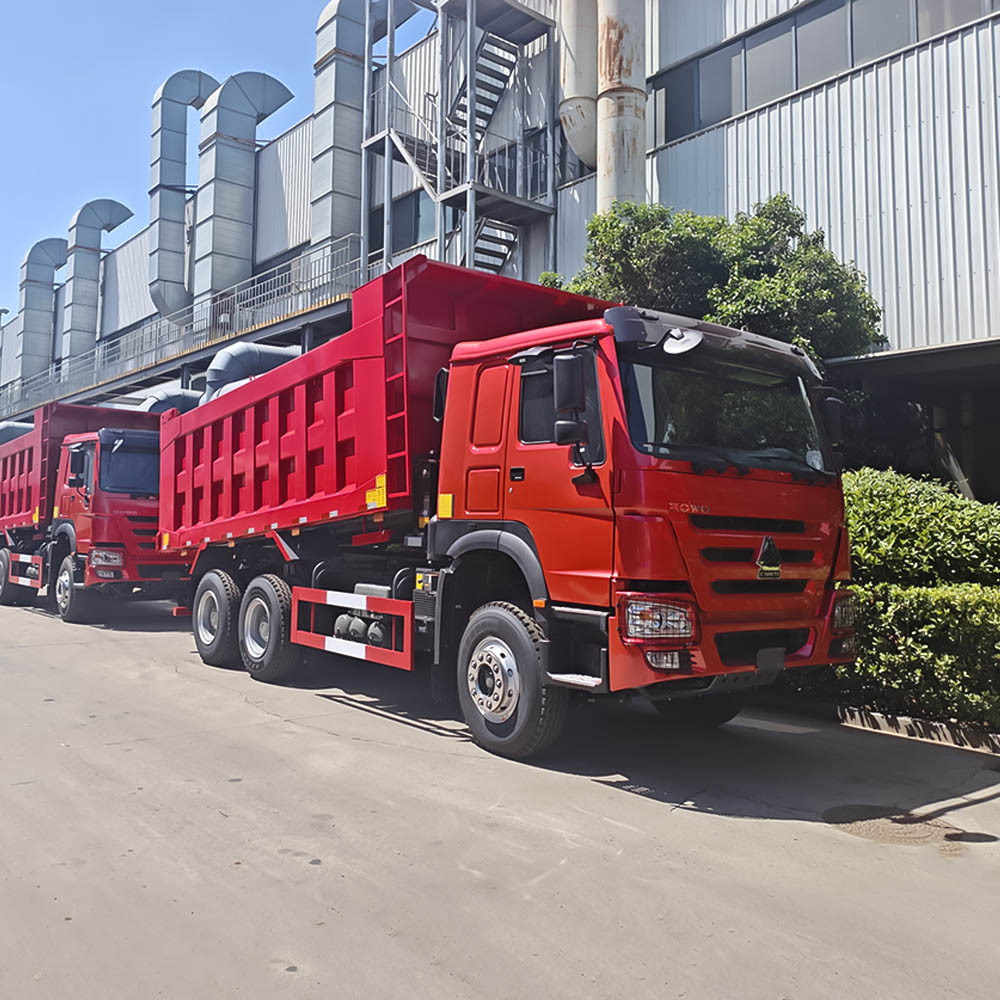Side profile of red HOWO 371HP 6x4 tipper truck ready for export