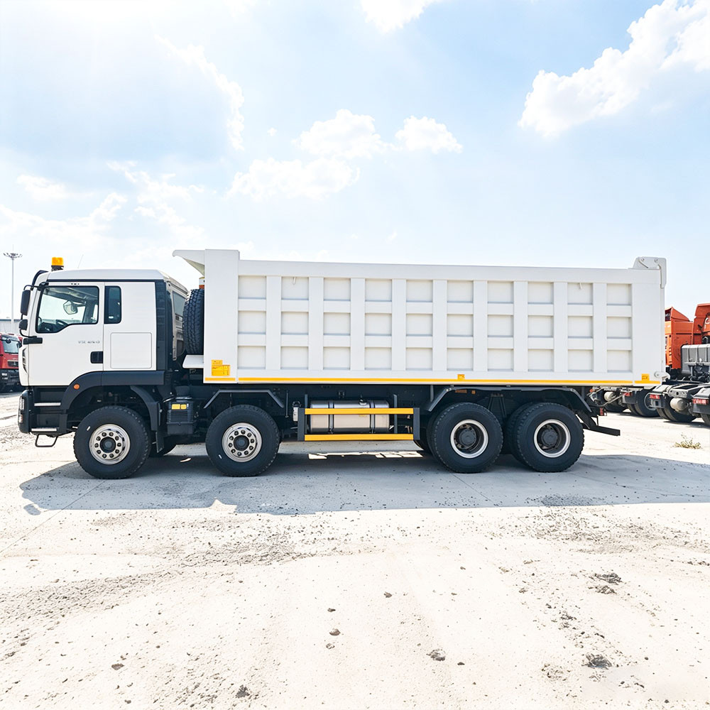 Side view profile of white HOWO TX 400HP 8x4 tipper truck showing chassis and fuel tank