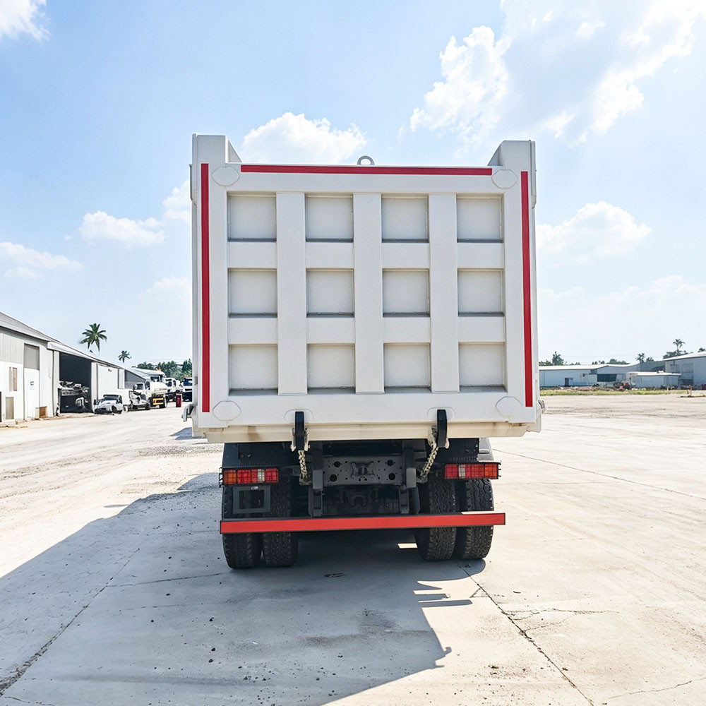 Direct rear view of white HOWO TX 8x4 dump truck tailgate and rear bumper