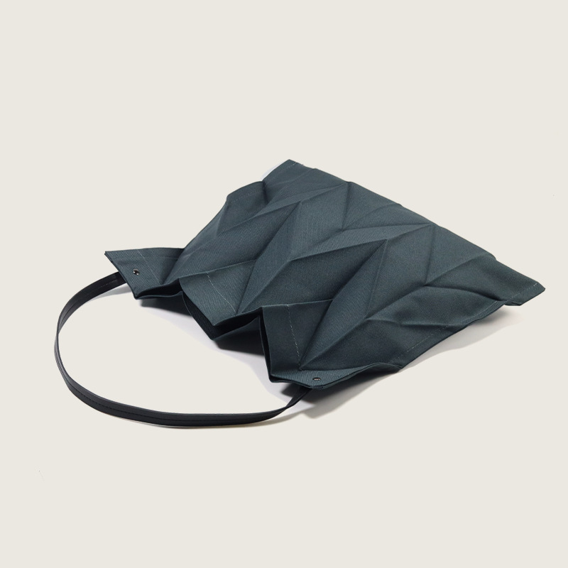 2025 Japanese and Korean pleated women's bag simple and lightweight folding canvas bag fashionable and artistic niche design hand-held shopping bag
