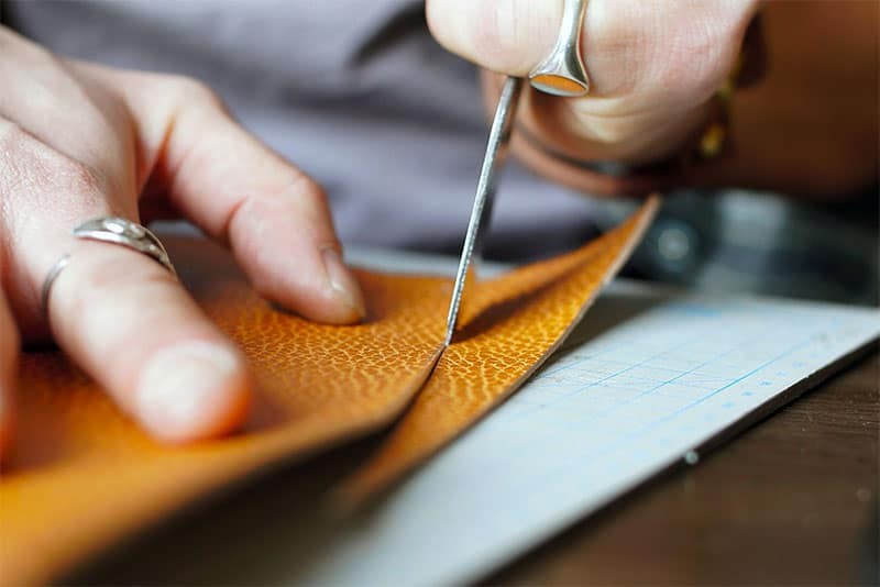 man cutting genuine leather make purse man cutting genuine leather make purse