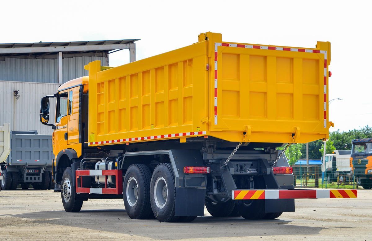 HOWO TX 400HP 6x4 dump truck rear three quarter view at delivery yard