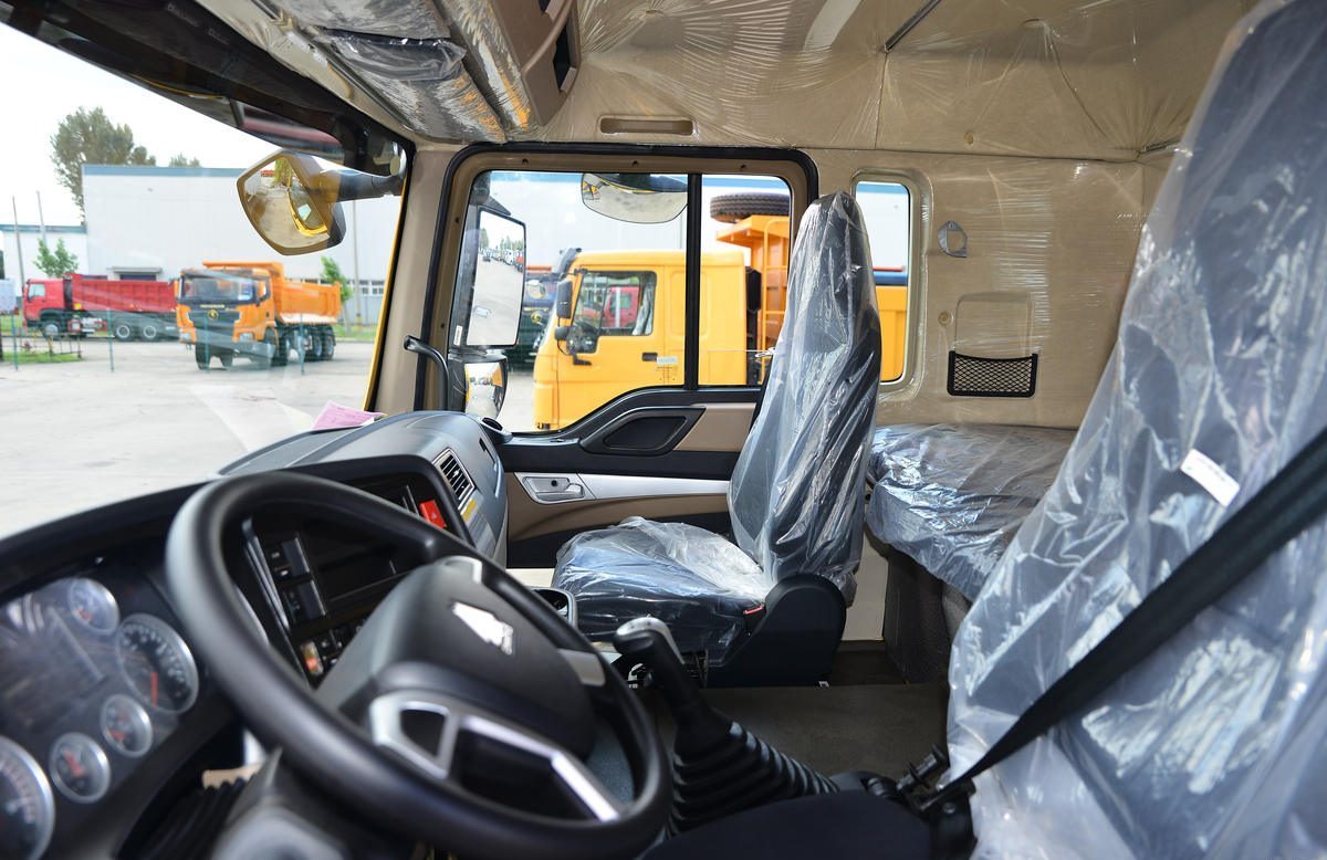 HOWO TX dump truck cabin interior with ergonomic dashboard and driver seat