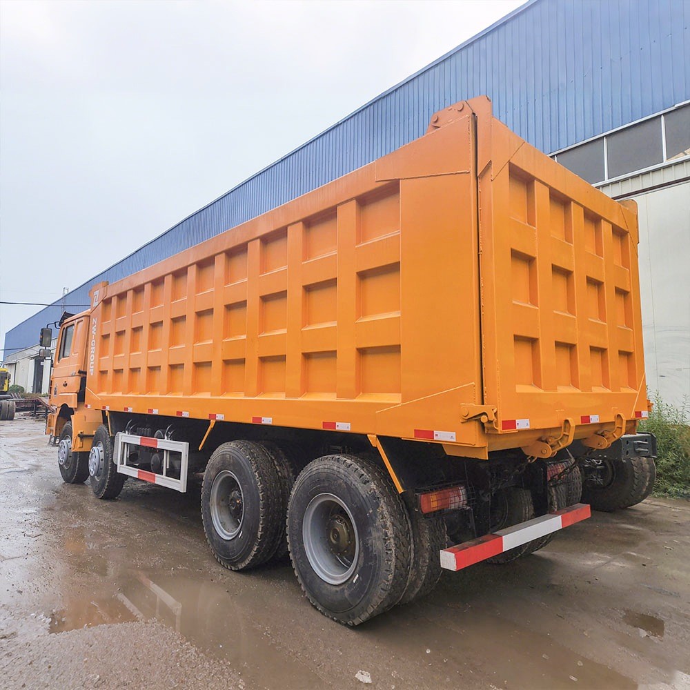 Shacman F3000 380HP 8x4 dump truck rear three quarter view showing dump body tilt and chassis