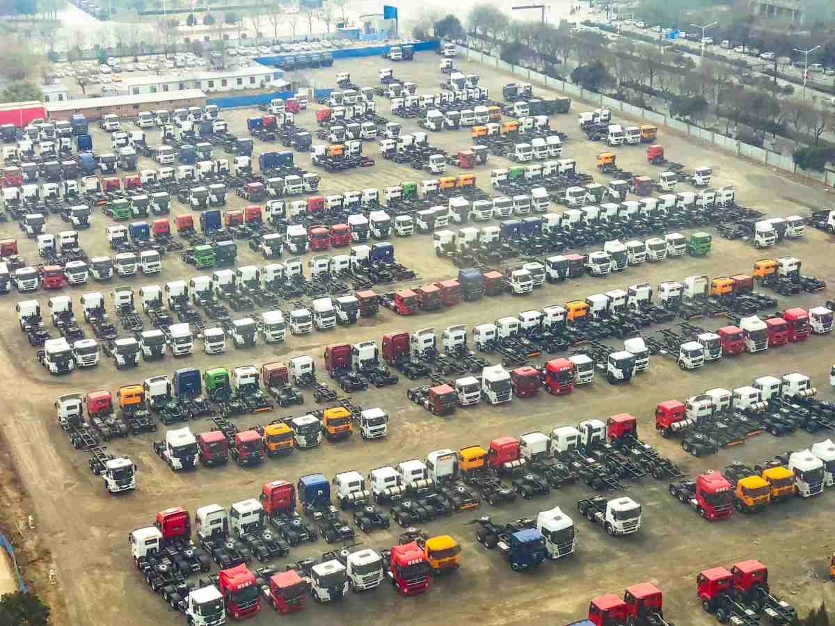 ZW Group Shacman heavy duty tractor trucks parked in factory yard showing large fleet ready for shipping