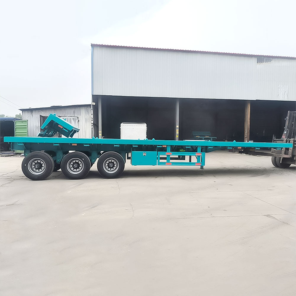 3 axle 40ft flatbed semi truck trailer side view showing full length flat deck for container and steel transport