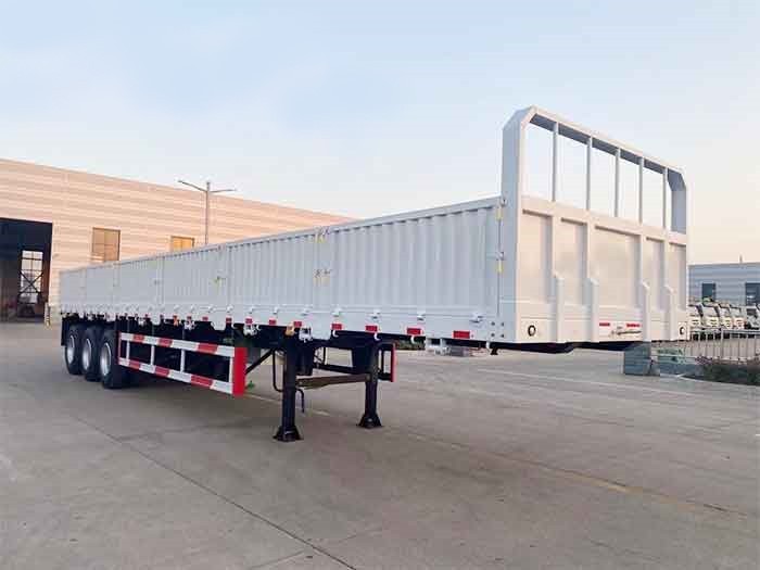 3 axle side wall cargo trailer front three quarter view highlighting side wall panels and three axle layout