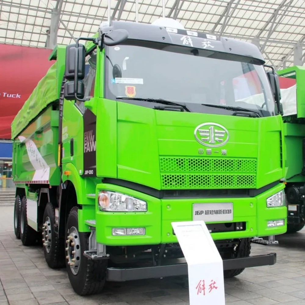 FAW J6P 8×4 dump truck front three quarter view highlighting cabin, multi axle layout and dump body