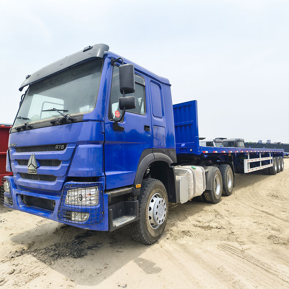 Blue HOWO tractor truck with ZW Group 3 axle 40ft flatbed semi trailer