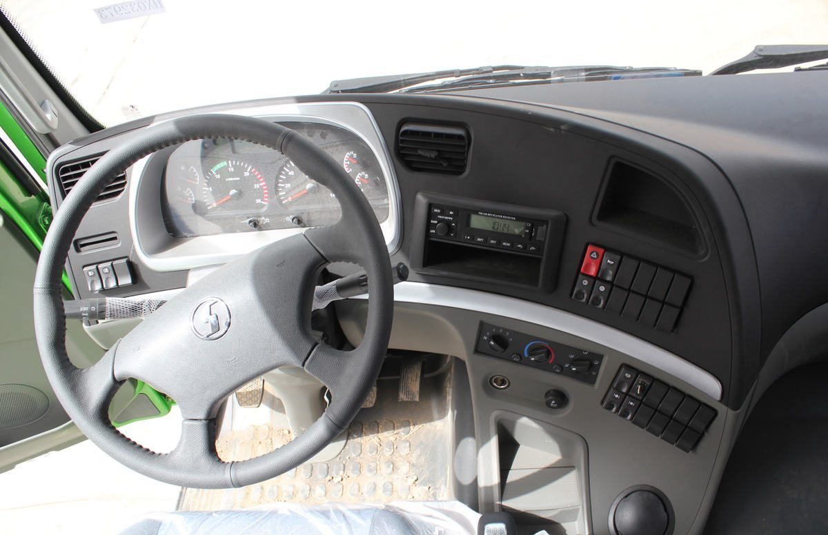 Shacman M3000 6x4 350HP dump truck steering wheel detail with instrument panel and controls