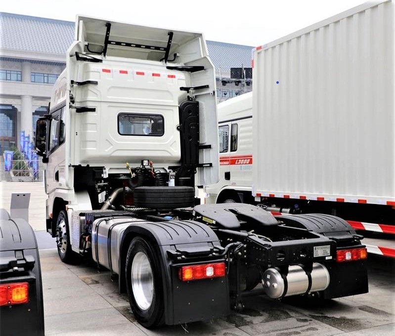 Shacman X3000 4x2 heavy duty tractor truck rear three quarter view showing fifth wheel and rear frame