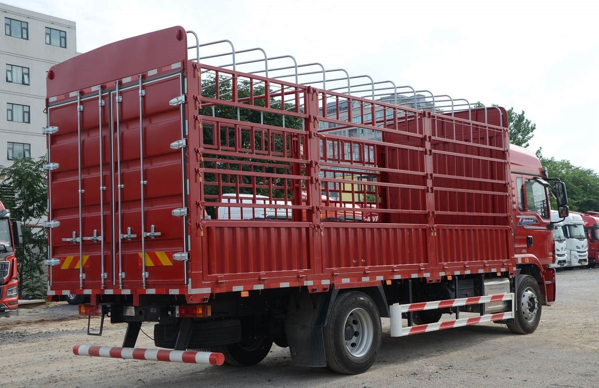 Shacman L5000 4x2 heavy duty cargo truck rear three quarter view showing cargo bed structure and rear frame
